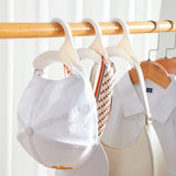Simple Non-invasive Handbag Hanger for Home and Office Use
